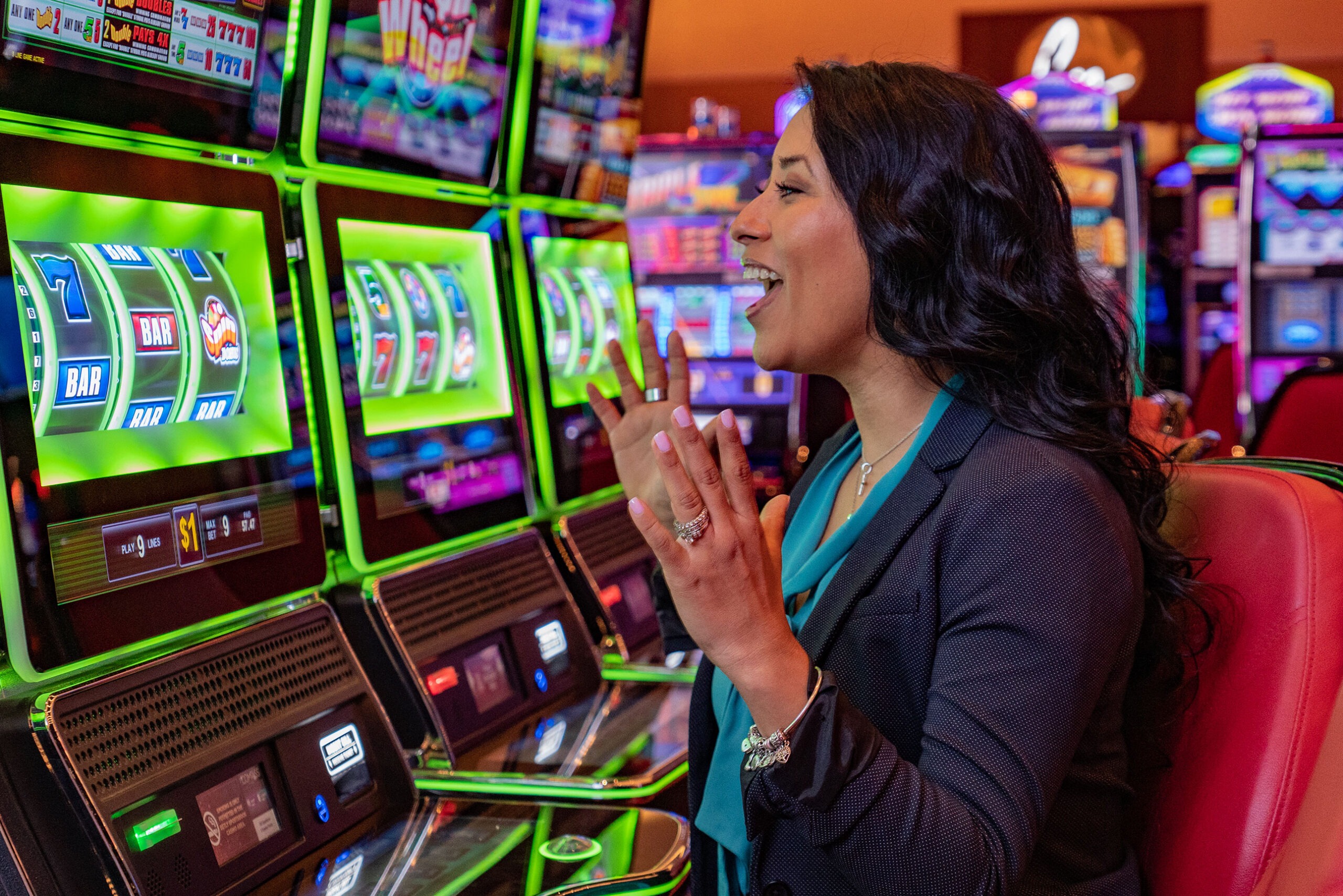 Woman playing slot machine