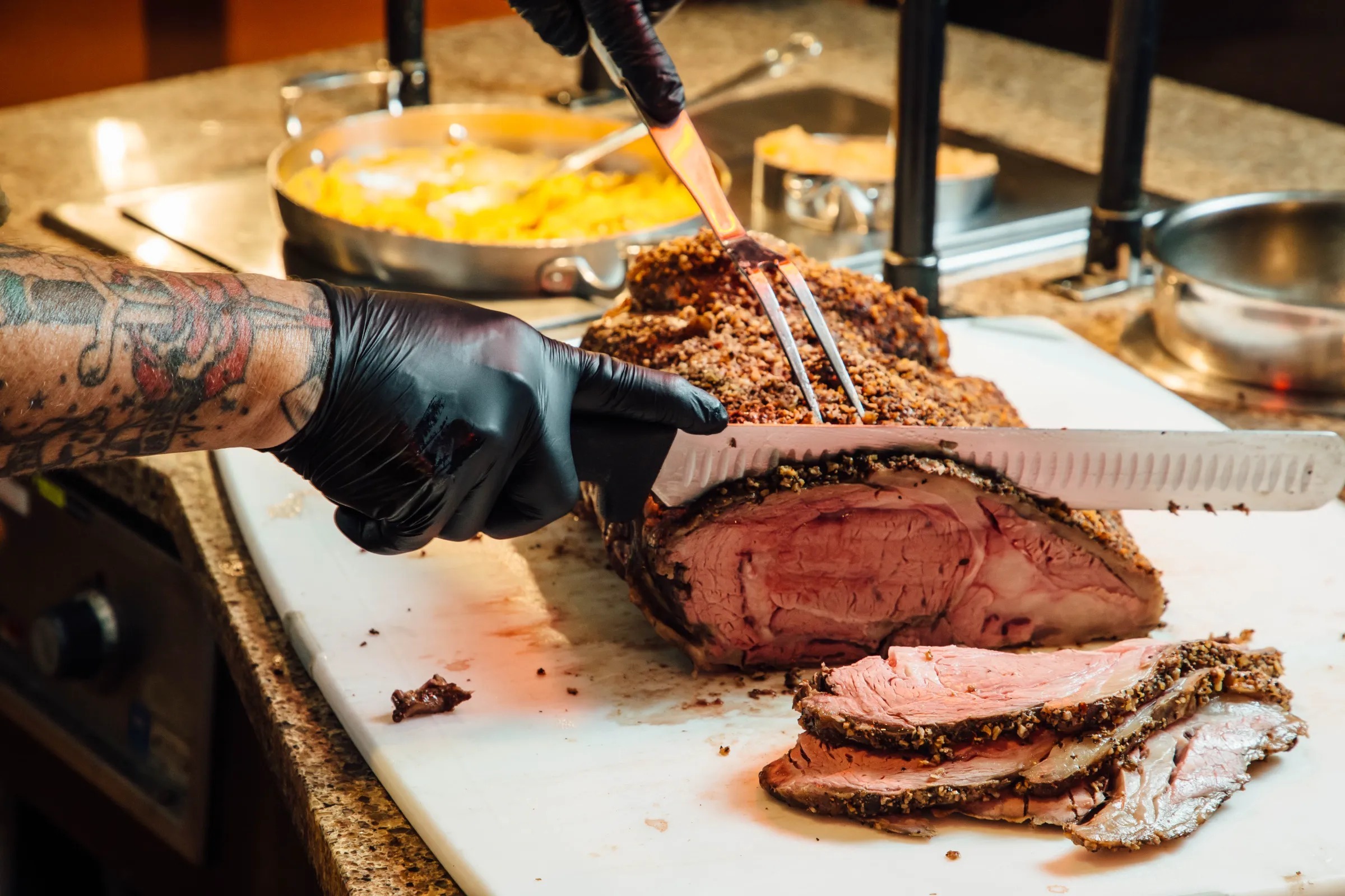 Chef slicing pork roast